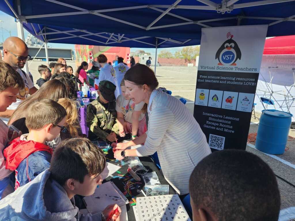 Students learning about magnetic fields at the VST Exhibit