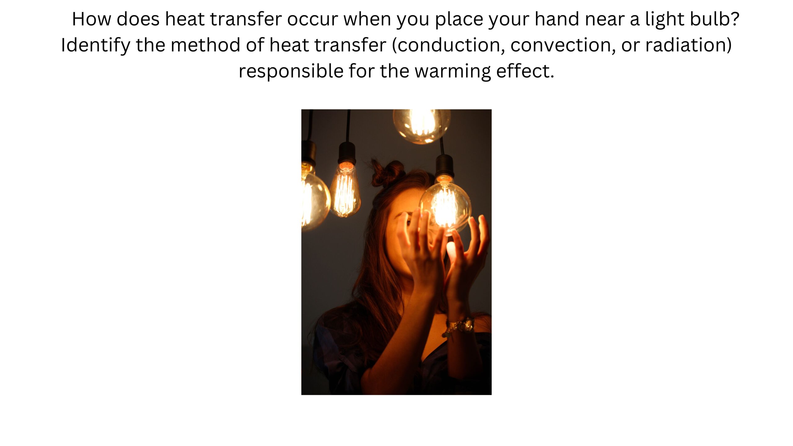 How does heat transfer occur when you place your hand near a light bulb? Identify whether conduction, convection, or radiation is responsible for the warming effect. A hand is held close to several glowing light bulbs without touching them.